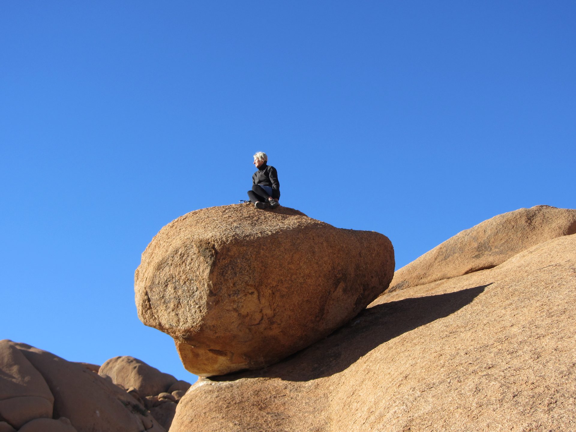 Jo Knight - atop a boulder Spitzkoppe Namibia